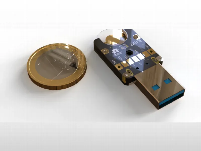 The openQCM Holder, USB version, next to a one-euro coin
