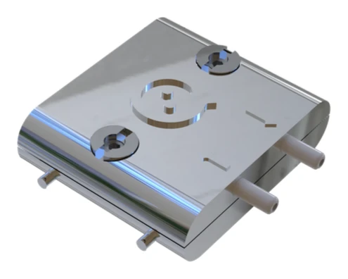 The standard fluidic module of openQCM NEXT: the flash chrome-plated shell with the openQCM mark, two fluid ports and two slotted nuts